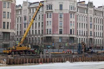 Reconstruction of Fontanka river embankment with industrial cranes