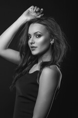 Naklejka premium Stylish studio portrait of a splendid brunette woman with perfect makeup