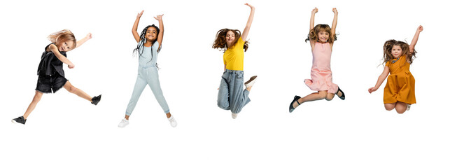 Art collage made of little and happy kids jumping isolated on white studio background. Human emotions, facial expression concept