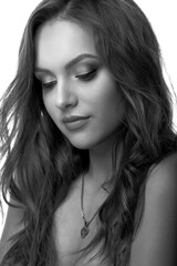 Closeup studio portrait of a cute woman with curly hair