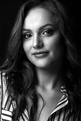 Monochrome portrait of a smiling young woman