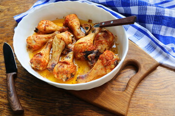 roasted chicken legs with herbs in the pan