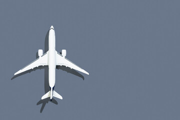 Naklejka na ściany i meble Airplane on a gray background. Travel and flights.