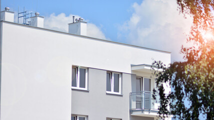  Modern apartment buildings on a sunny day with a blue sky. Facade of a modern apartment building. Glass surface with sunlight.