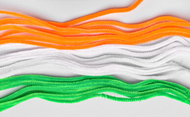 Stripes in colors of Indian flag on light background