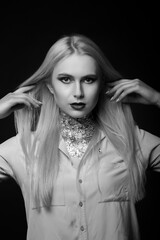 Fototapeta premium Stunning blond model posing with foil on her neck