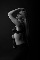 Sensual model wears bra posing at studio