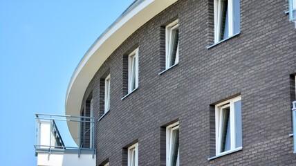  Modern apartment buildings on a sunny day with a blue sky. Facade of a modern apartment building. Glass surface with sunlight.