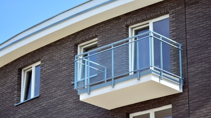  Modern apartment buildings on a sunny day with a blue sky. Facade of a modern apartment building. Glass surface with sunlight.