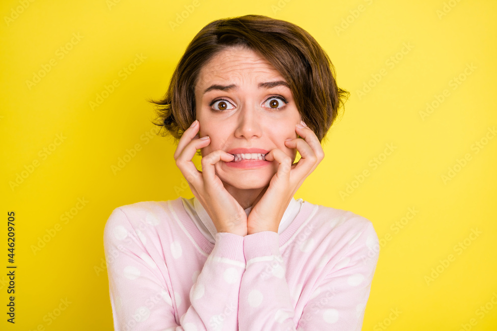 Sticker photo portrait troubled afraid girl nervous biting fingers staring isolated bright yellow color back