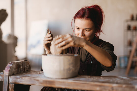 Young Woman Sculptor Artist Creating A Bust Sculpture