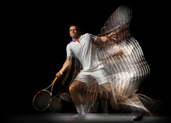 Portrait of young man, male tennis player in motion and action isolated on dark background....