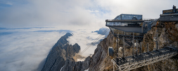 Germany, Bavaria, Zugspitze. Hikers enjoy an inspiring view to the Tirol from the Zugspitze summit in Bavaria, Germany.