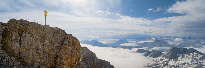 Germany, Bavaria, Zugspitze. Hikers enjoy an inspiring view to the Tirol from the Zugspitze summit in Bavaria, Germany.