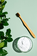 Waste-free bathroom accessories on light green background. Eco cosmetics products and tools. Zero...
