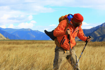 trekking mountains man walking sticks travel adventure man with backpack