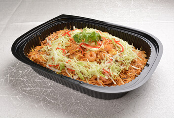 wok fried Singapore bee hoon noodle mee with prawn seafood in black party bento tray box for asian take away halal menu