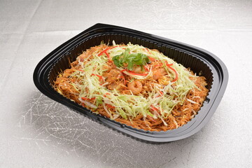 wok fried Singapore bee hoon noodle mee with prawn seafood in black party bento tray box for asian take away halal menu