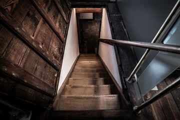 Old wooden stairs going down to a basement - obrazy, fototapety, plakaty