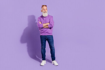 Full length body size view of attractive cheerful curious grey-haired man foldded arms copy space isolated over purple violet color background