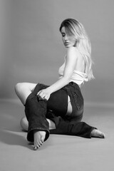 woman in torn jeans