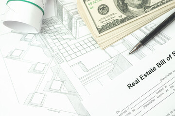 Purchase and construction of land for a new home, building projects and blueprints, workspace concept