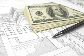 Working on construction project background. Office table with dollars and pen