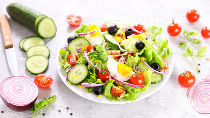 vegetable salad with egg,  cucumber and tomato