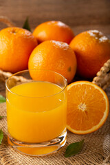 Glass with orange juice on the table. © WS Studio