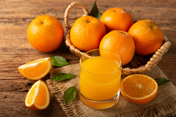Glass with orange juice on the table. © WS Studio