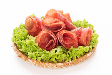 Sandwich with salami sausage on white background.