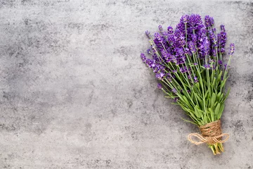 Poster Lavender flowers, bouquet on rustic background, overhead. © gitusik