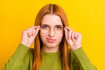 Photo portrait red haired woman in glasses checking vision isolated vivid yellow color background