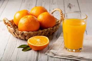 Obraz na płótnie Canvas Glass with orange juice on the table.