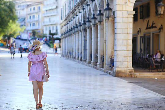 Fototapeta female hat back old town mediterranean, back view without face, model in dress and hat, italian european street
