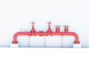 Pipe or row of red color fire fighting or tap water sprinkler supply pipeline system on white...