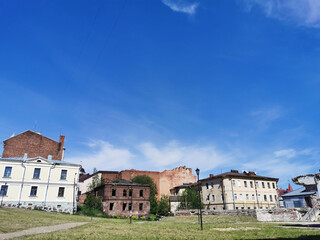Fototapeta premium Old, partially destroyed houses, on a sunny summer day in Vyborg.