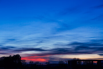 Dramatic sunset and sunrise sky. Purple and blue clouds
