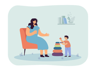 Mother sitting on chair, helping her son assemble pyramid. Mom and kid playing and spending time together flat vector illustration. Parenthood concept for banner, website design or landing web page