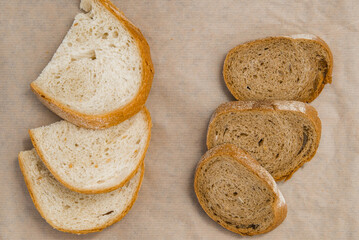 pieces of bread are white and rye gray bread. comparison of the bread variety. gluten-free product