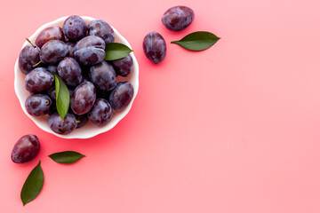 Layout set of ripe purple plums. Top view
