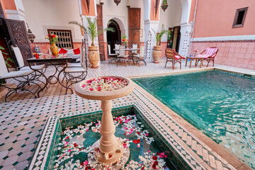Traveling by Morocco. Relaxing in festive moroccan traditional riad in medina. - obrazy, fototapety, plakaty