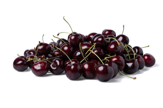 Pile of Fresh dark red cherries of the type Kordia isolated on a white background