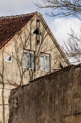Fototapeta na wymiar Old historic building in sunny winter day, Kuldiga old town, Latvia.