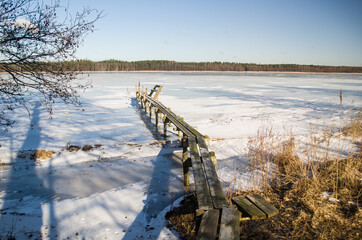 Boat mooring in winter on the island of Lake Usma.