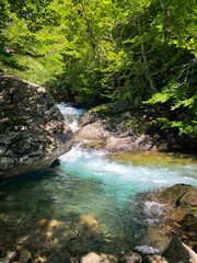 Secret natural pool with turquoise water located in a natural landscape.
