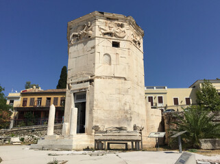 Obraz premium The Tower of the Winds is an octagonal Pentelic marble clocktower in the Roman Agora in Athens that functioned as a horologion or 