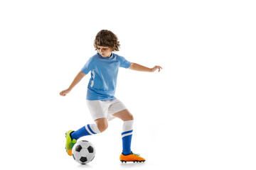 Naklejka na ściany i meble Portrait of preschool boy, football soccer player in action, motion training isolated on white studio background. Concept of sport, game, hobby