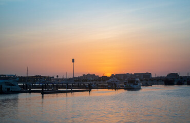 Fototapeta premium Dubai, UAE - 07.19.2021 Sunset in Dubai harbor. Outdoors