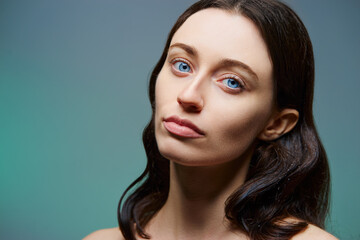 Fototapeta premium Natural beauty. Beautiful young woman with smooth glowing skin.